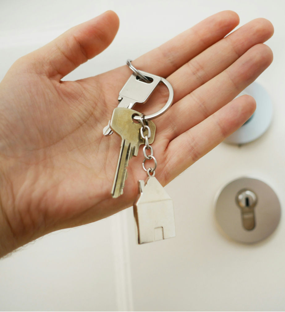 holding house key