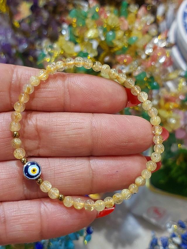 ข้อมือหินไหมทอง (Golden Rutile Quartz) 4 มิล จี้ evil eye