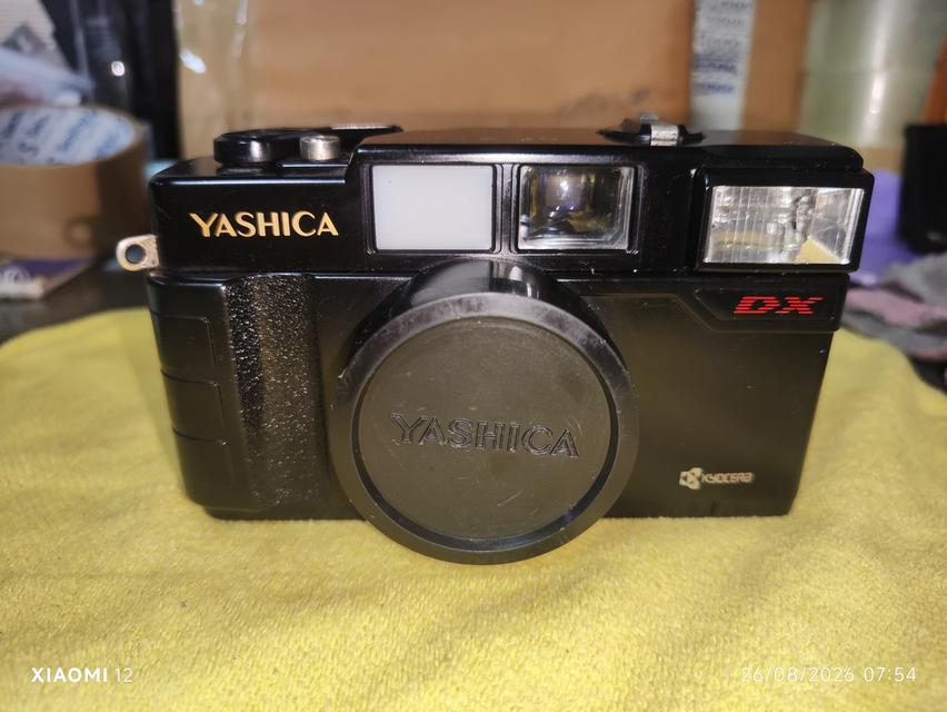 กล้องฟิล์ม Yashica MF-2 Super ผลิตที่ญี่ปุ่นเมื่อปี 1986 ผลิตโดย Kyocera Corporation สภาพตัวกล่องสวยสมบูรณ์ไม่มีตำหนิ ซองหนังมีตำหนิ(รูปสุดท้าย) รูปที่ 1