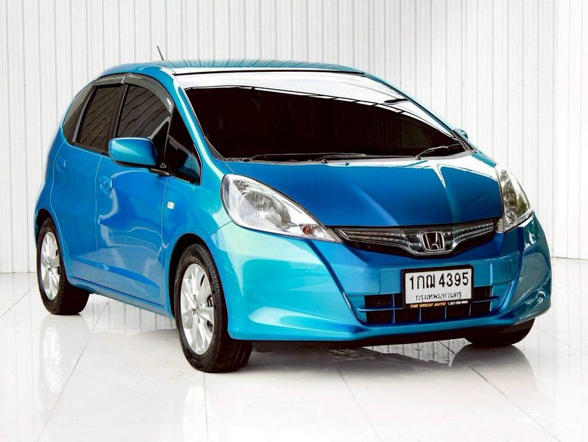 HONDA JAZZ 1.3 HYBRID ปี 2012 โฉม ปี08-14 เกียร์ AUTO สีฟ้า เครื่องยนต์ เบนซิน + ไฟฟ้า ไมล์น้อย 208,884 Km.