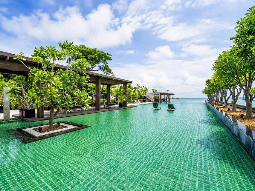 For Sale — 1-Bedroom Condo at Reflection Jomtien Beach Beachfront Condo Unit size: 61 sq.m Floor: 21• High-floor unit Beautiful view Fully furnished 10