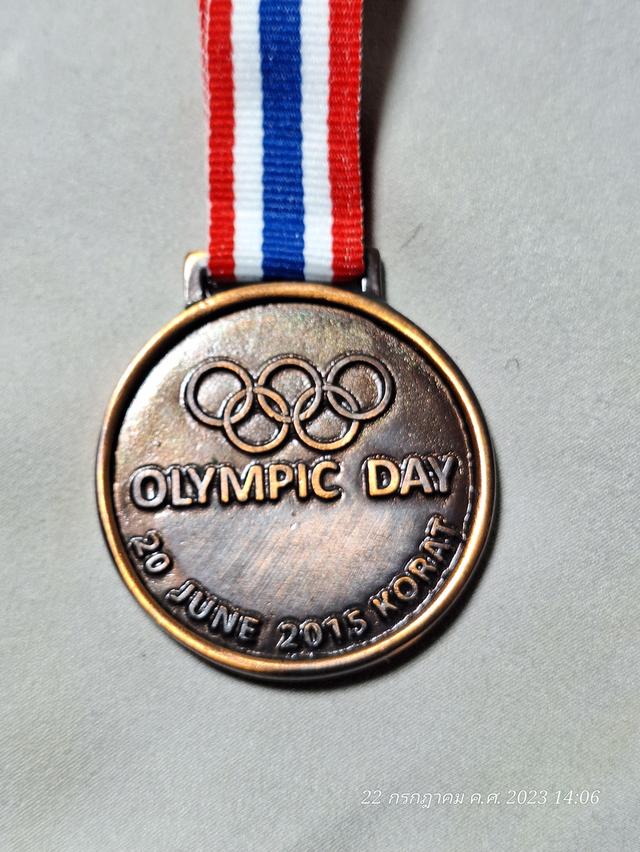 เหรียญที่ระลึกกีฬาโอลิมปิค ประเทศไทยเป็นเจ้าภาพที่จังหวัดนครราชสีมา โดยเหรียญอีกด้านจนมีรูปหลวงพ่อคูณ